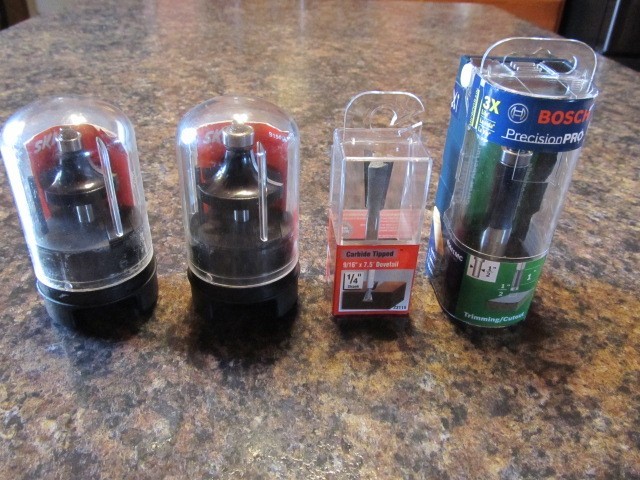 FOUR NEW ROUTER BITS - SKIL, BOSCH, VERMONT AMERICAN IN CASES