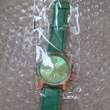 Geneva Platinum Quartz Watch Green Strap New in packet. 