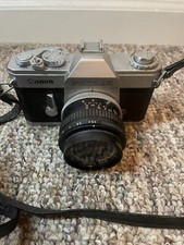 Canon Pellix QL 35mm SLR Film Camera with FL 35mm 1:3.5 Lens