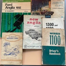 Selection of 1960s car owners manuals and sevice books and a J. Player card book