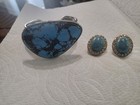 Women bracelet with matching earrings. Has a big turquoise stone.