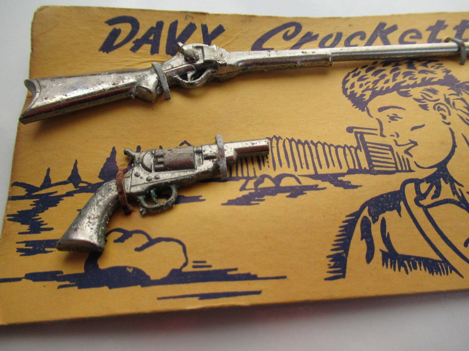 VINTAGE DAVY CROCKETT SMALL TOY METAL GUN RIFLE ON ORIGINAL CARD MARKED