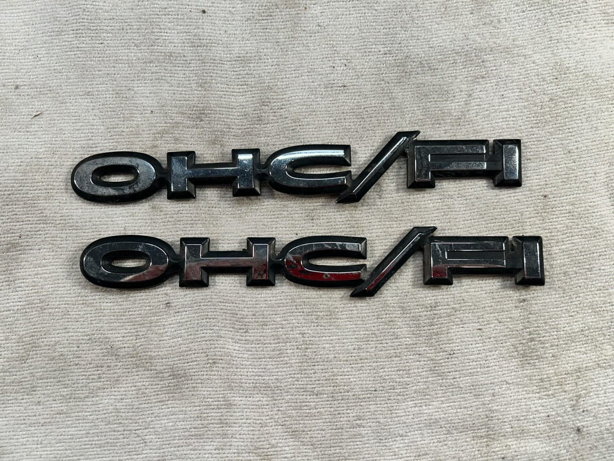 84-91 Pontiac Sunbird J2000 Front Fender OHC/FI Emblem Badge BLACK