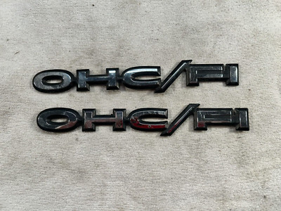 84-91 Pontiac Sunbird J2000 Front Fender OHC/FI Emblem Badge BLACK