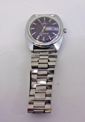 1970's vintage Timex Q quartz day-date watch with a blue dial.