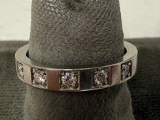 Bulgari 18k white gold ring. 5 diamonds. .20ct. size 5 signed.