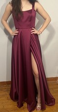 Xscape brand gown in a magenta color.