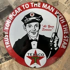 VINTAGE TEXACO TRUST YOUR CAR TO MAN W STAR 12 INCH CONVEX PORCELAIN ENAMEL SIGN