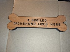 A spoiled Schnoodle lives here sign 11.5in long Wall dec for dog lovers.