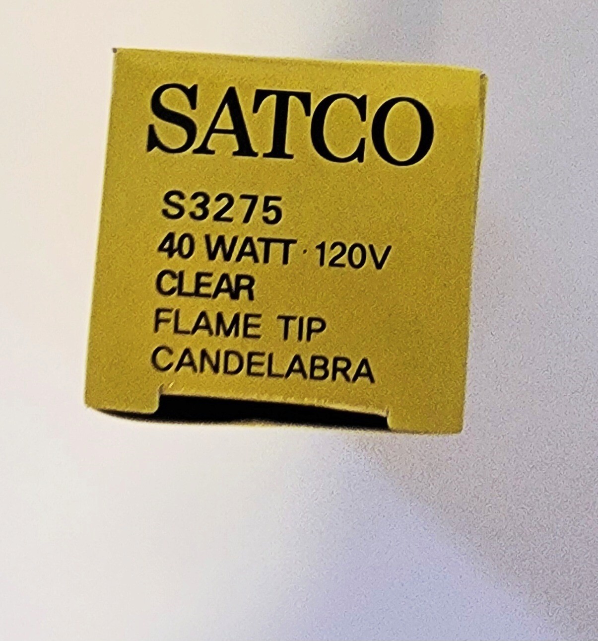 Brand new and in box Satco 40W clear candelabra shaped light bulb with flame tip