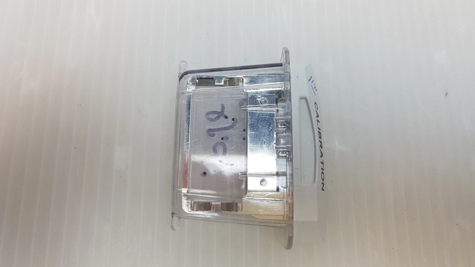 Side view of the LB-003811 filter cartridge inside its clear protective cover
