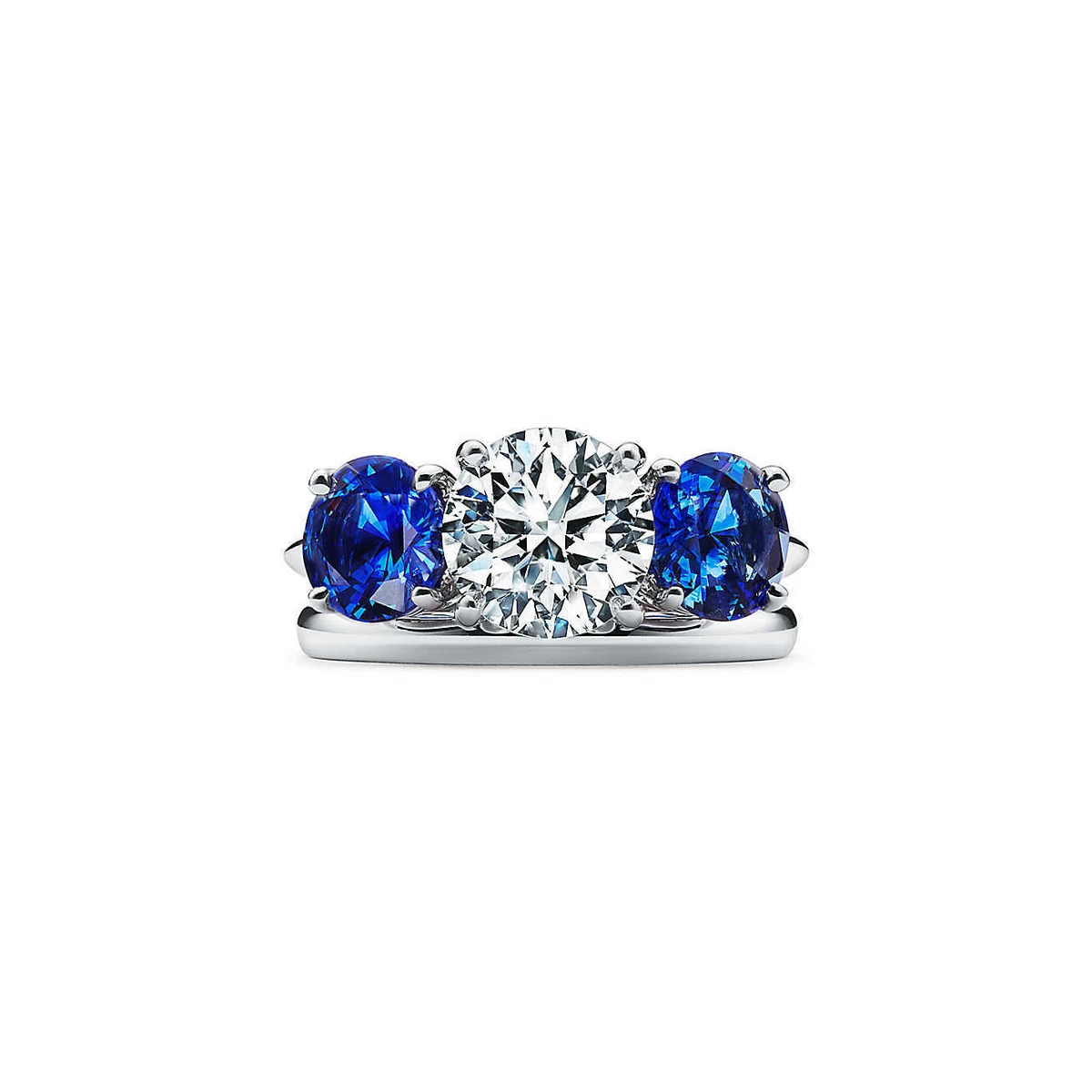 Round diamond with shop sapphire side stones