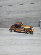 handcrafted wooden car, often styled as a classic coupe Used 