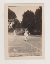 Beautiful Young Woman Plays Tennis on Court in the Early 1930s Snapshot Photo