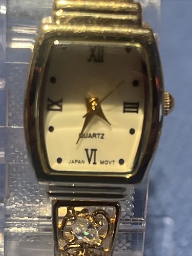 #664-Women Quartz Watch Gold Tone With Nice Diamond Accent on Band