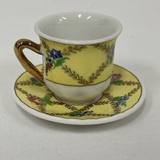 Vintage Miniature Teacup and Saucer with flower Decoration Yellow Gold Florals