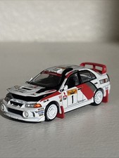 MITSUBISHI LANCER EVO IV RHD #1 WINNER RALLY CATALUNYA 1/64 BY POP RACE