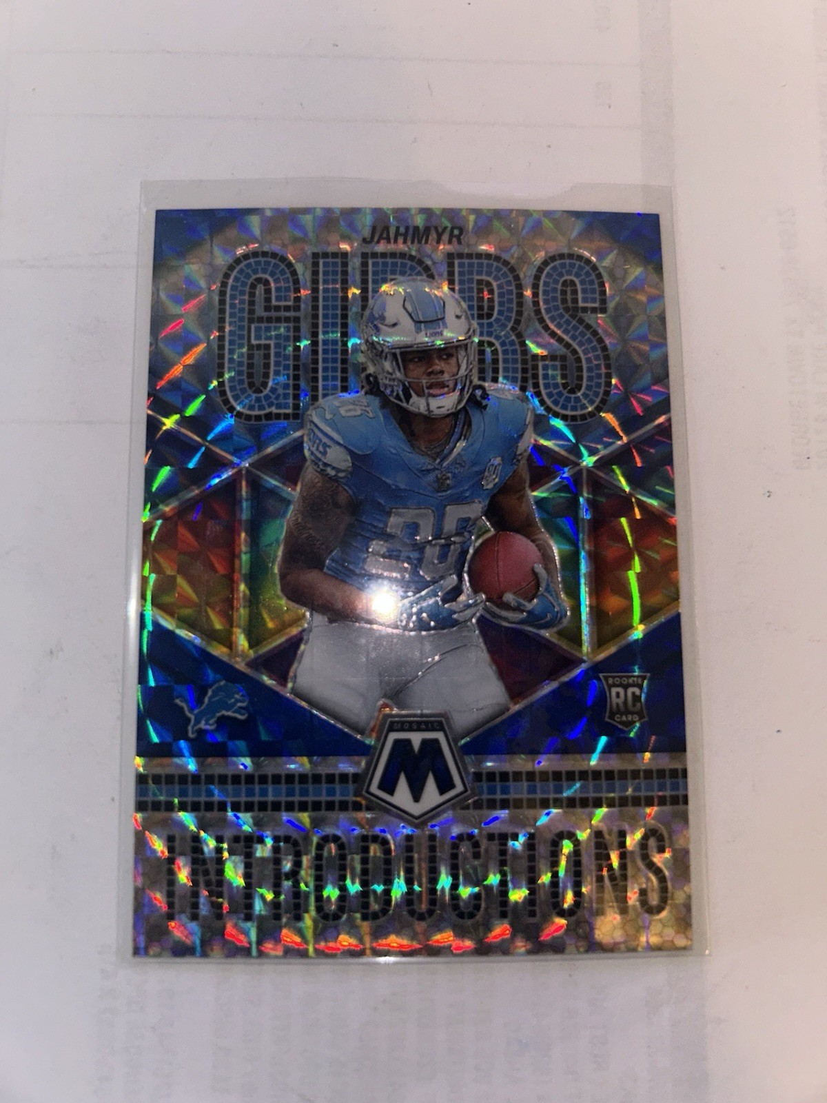 2023 Panini Mosaic - Introductions Jahmyr Gibbs #I-5 Blue Mosaic Prizm /99 (RC)