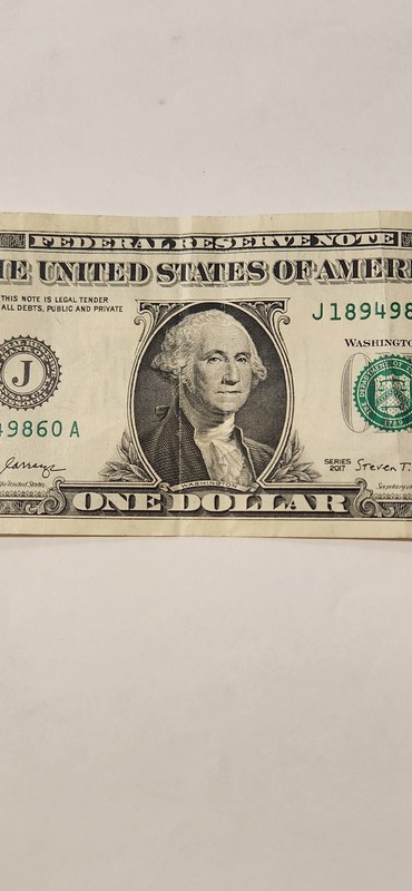 *ERROR NOTE*$1 bill, extra ink on upper serial number 