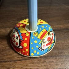 Vintage Tin Spinning Top with Clown Graphics