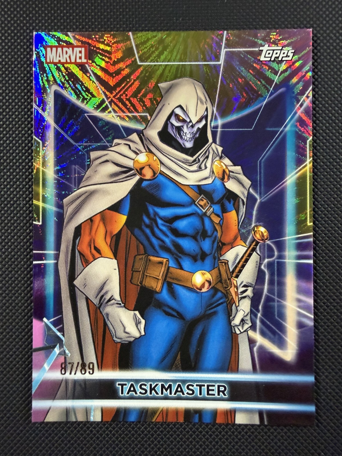 2026 Topps Marvel Neon Taskmaster #27 Jubilee's Yellow & Pink Fireworks Foil /89