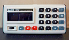 VINTAGE CASIO MINI CM-605 MINI w/ CASE - FIRST GENERATION ELECTRONIC CALCULATOR
