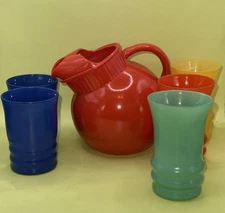 VTG Anchor Hocking Set Of Red Tilted Pitcher And (5) 4” Cups (6) 4.5” Cups.
