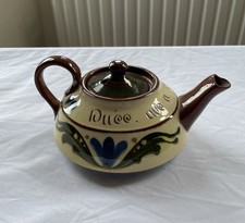 A hand-painted Torquay Motto Ware ceramic teapot with the motto "Du'ee."