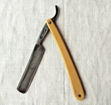 Vintage hazard RAZOR, plastic handle, brand is unreadable, good condition