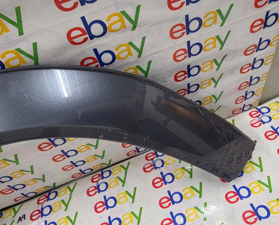 02-06 GUARDABARROS DELANTERO SUZUKI GRAND VITARA XL-7 LH MOLDURA ACAMPANADA FABRICANTE ORIGINAL DAÑADO Foto 3 de 4