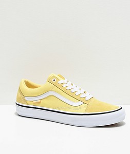 pale yellow slip on vans