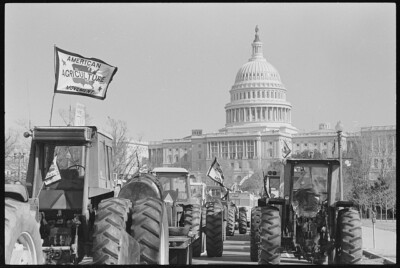 Tractorcade, one flying the flag of the American Agriculture Movement,