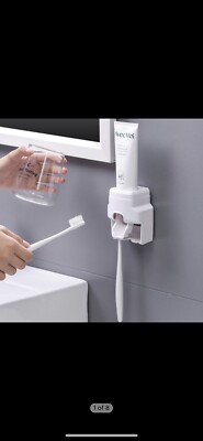Toothbrush Holder/ Toothpaste Dispenser for Adults and Children. Hangs on wall.