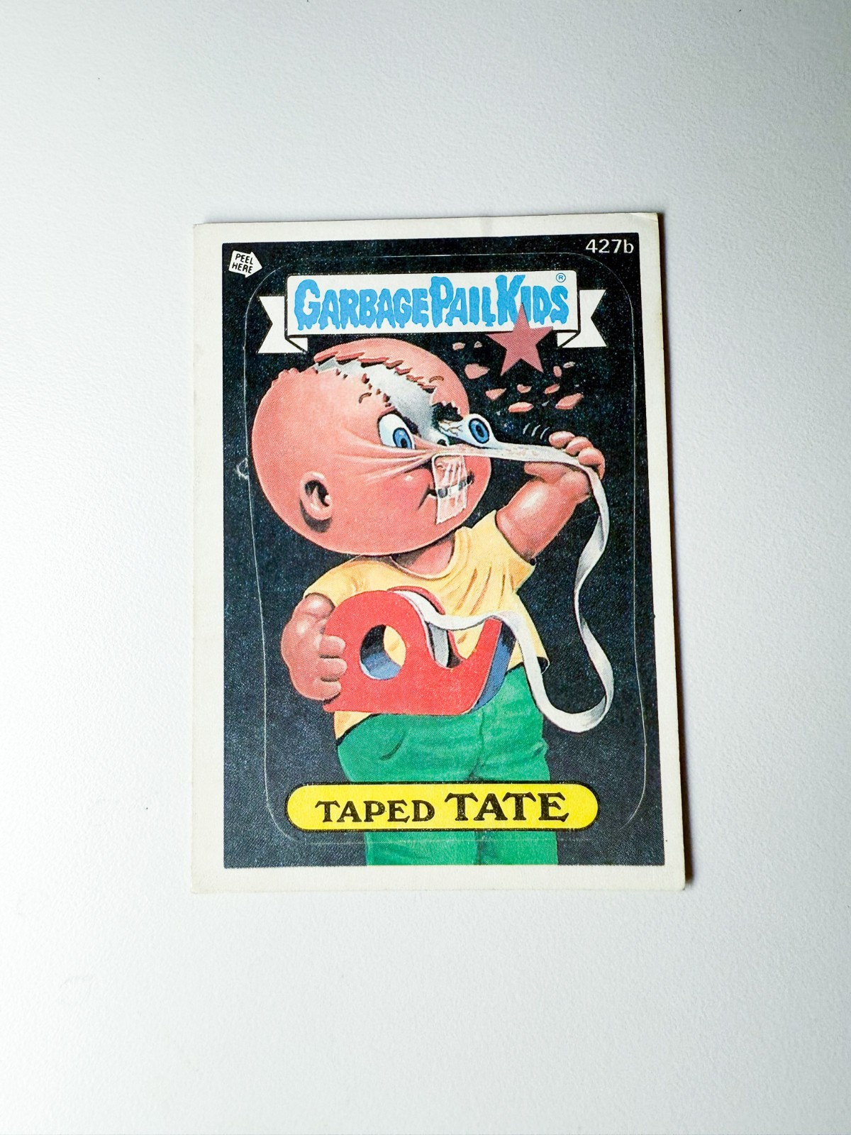 Taped TATE #427b 1987 Garbage Pail Kids trading card — raw and PSA graded price guide