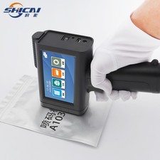 Handheld Inkjet Printer Prints Batch Number and Expiry Date on Pizza Boxes