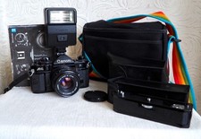 Vintage CANON A-1 35mm film SLR camera kit with flash and extras 