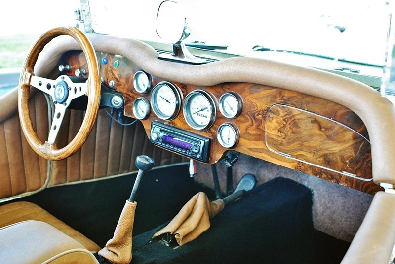 The interior is nicely appointed, with bucket seats and a wood-paneled dash with plenty of instruments.