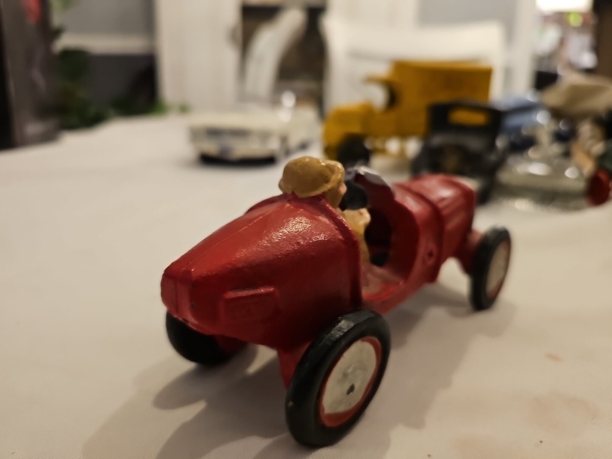 Vintage cast iron toy race car metal painted Red with Beige driver