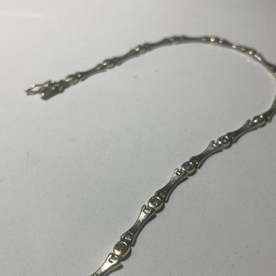 Brushed white gold bracelet with man made diamonds. 9.5  inches