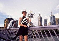 Martina Hingis of Switzerland poses with the trophy in front Melbo- Old Photo