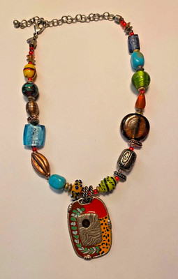 Chicos Boho-Style Statement Necklace with a large, artistic pendant.