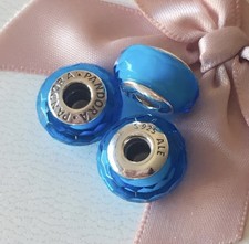 Authentic retired Pandora Sterling Silver core blue faceted murano glass bead