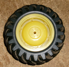 1/16 john deere 4.5" dia. x 1.75"W plastic rim rubber tractor tire good used