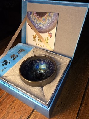 Beautiful Black Porcelain Jianzhan Teacup With Peacock Glaze And Master Stamp.