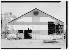 11. Detail of western facade, note large and unique exhaust fan at roof peak. -