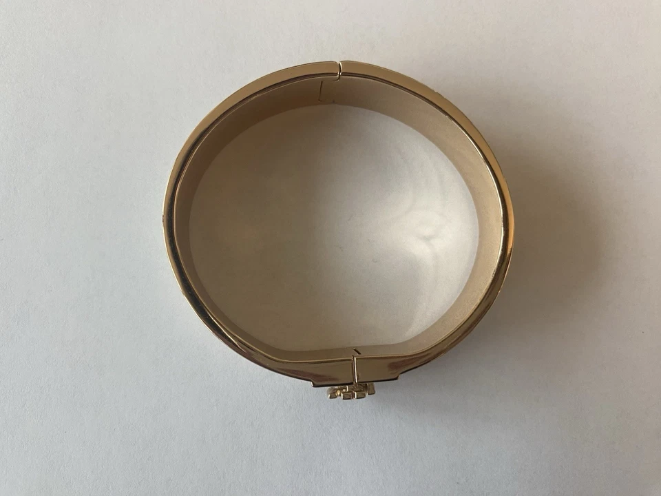 Brazalete con bisagras Kira blanco y dorado Tory Burch Foto 2 de 3