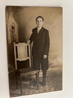 Young Man in Suit Standing by Chair Neat Flooring RPPC Postcard