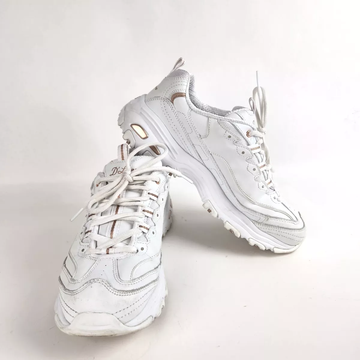 Skechers white and rose gold store