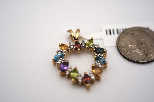 14 KARAT YELLOW GOLD MULTI STONE PENDANT. DIAMOND, CITRINE, AMETHYST, GARNET