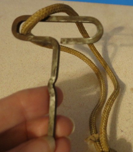 MYSTERY KEY ON CORD FLAT 2 3/4" LONG BUMP IN THE MIDDLE - Picture 2 of 3